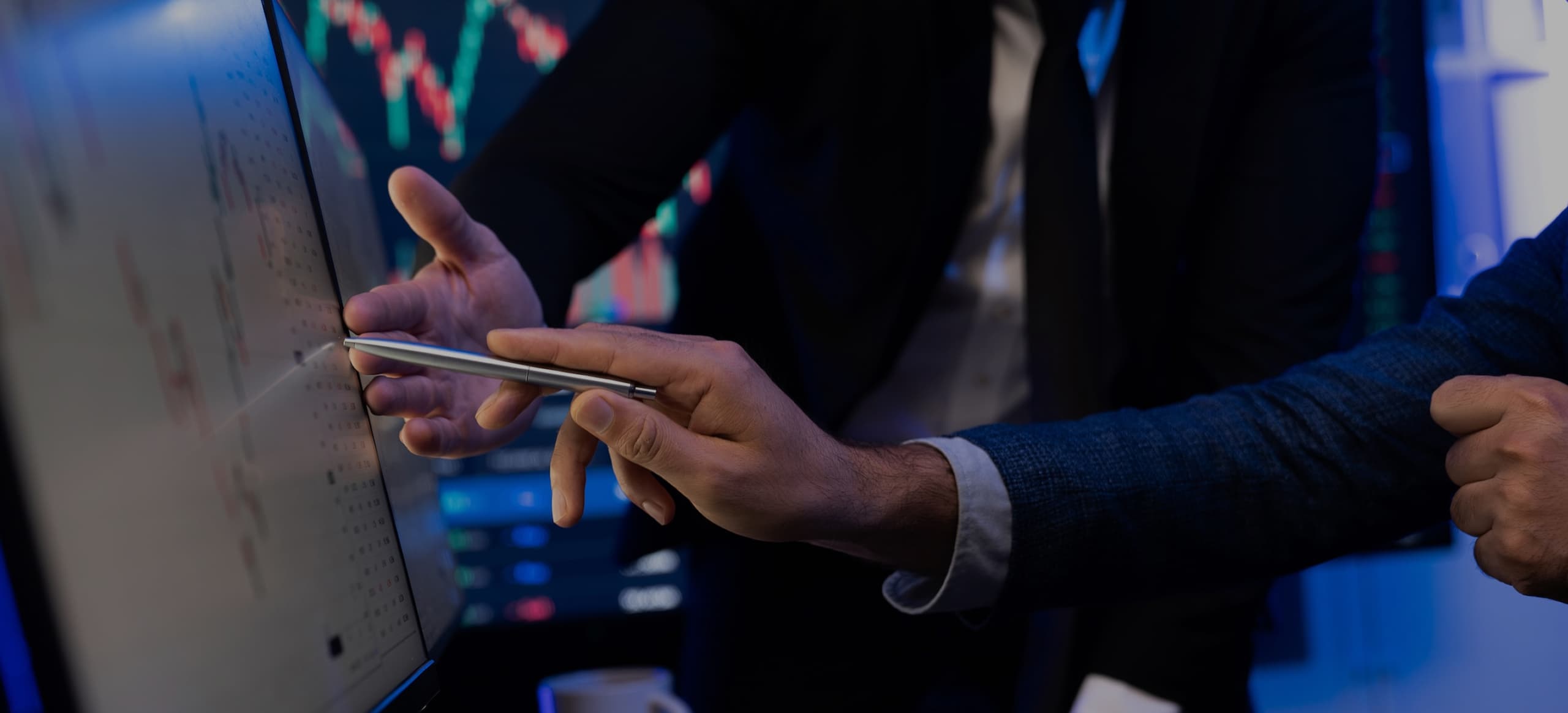 two-stock-investors-pointing-interest-market-stock-monitor-screen-sellable 1